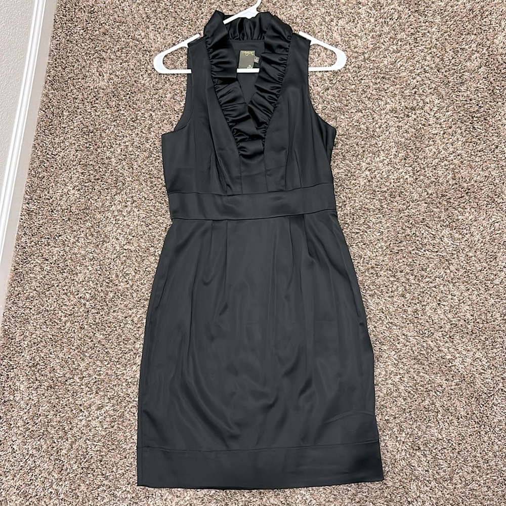 Black sleeveless knee length ruffle neckline party dress
